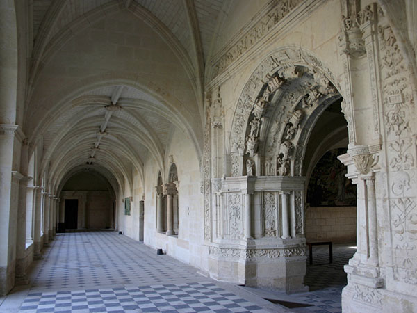 Royal Abbey of Fontevraud, the cloister, the gallery of the East wing with the portal of the chapter house